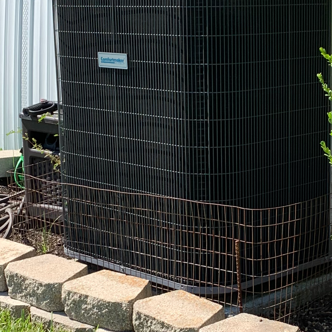 AC outdoor unit with protective cage installation